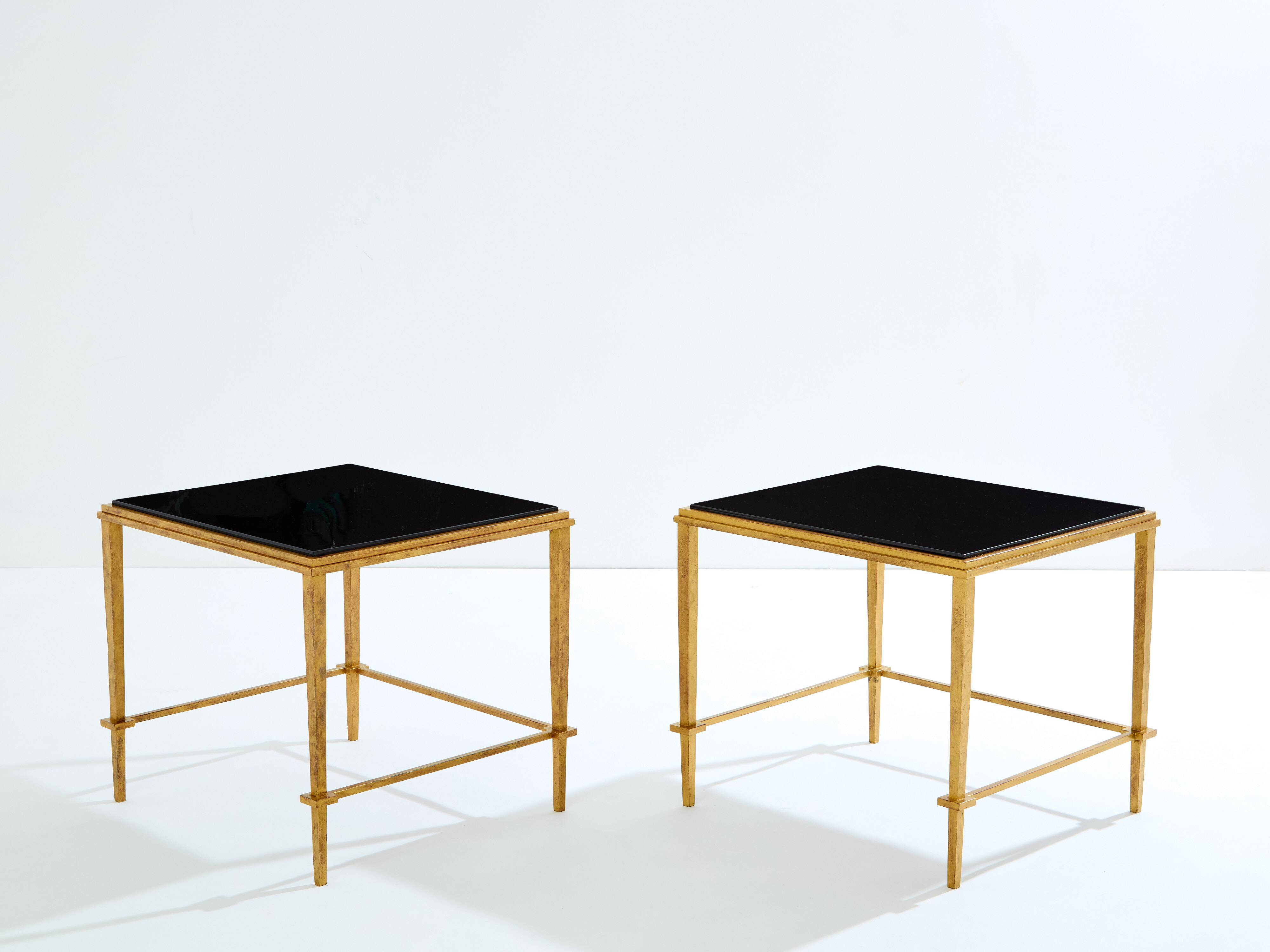 Pair of side tables in gilded iron and black lacquer Maison Ramsay 1950