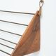 Wall-mounted walnut bookshelf by Carl Auböck, 1950s