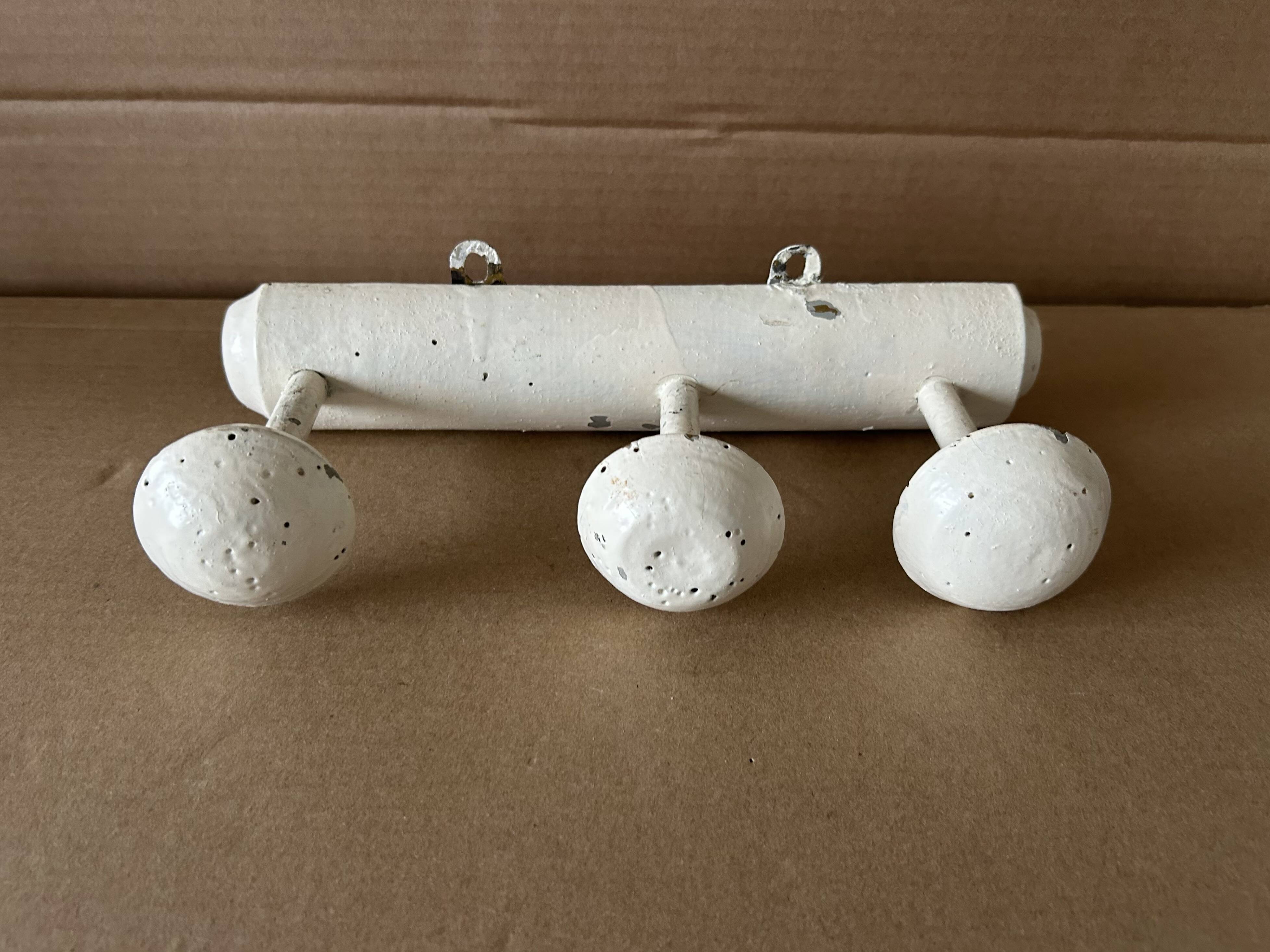 Antique wooden wall-mounted coat rack