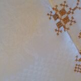 Damask tablecloth with golden patterns