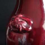 Beef blood vase decorated with taoties and flaming, China, 34cm, 19th century