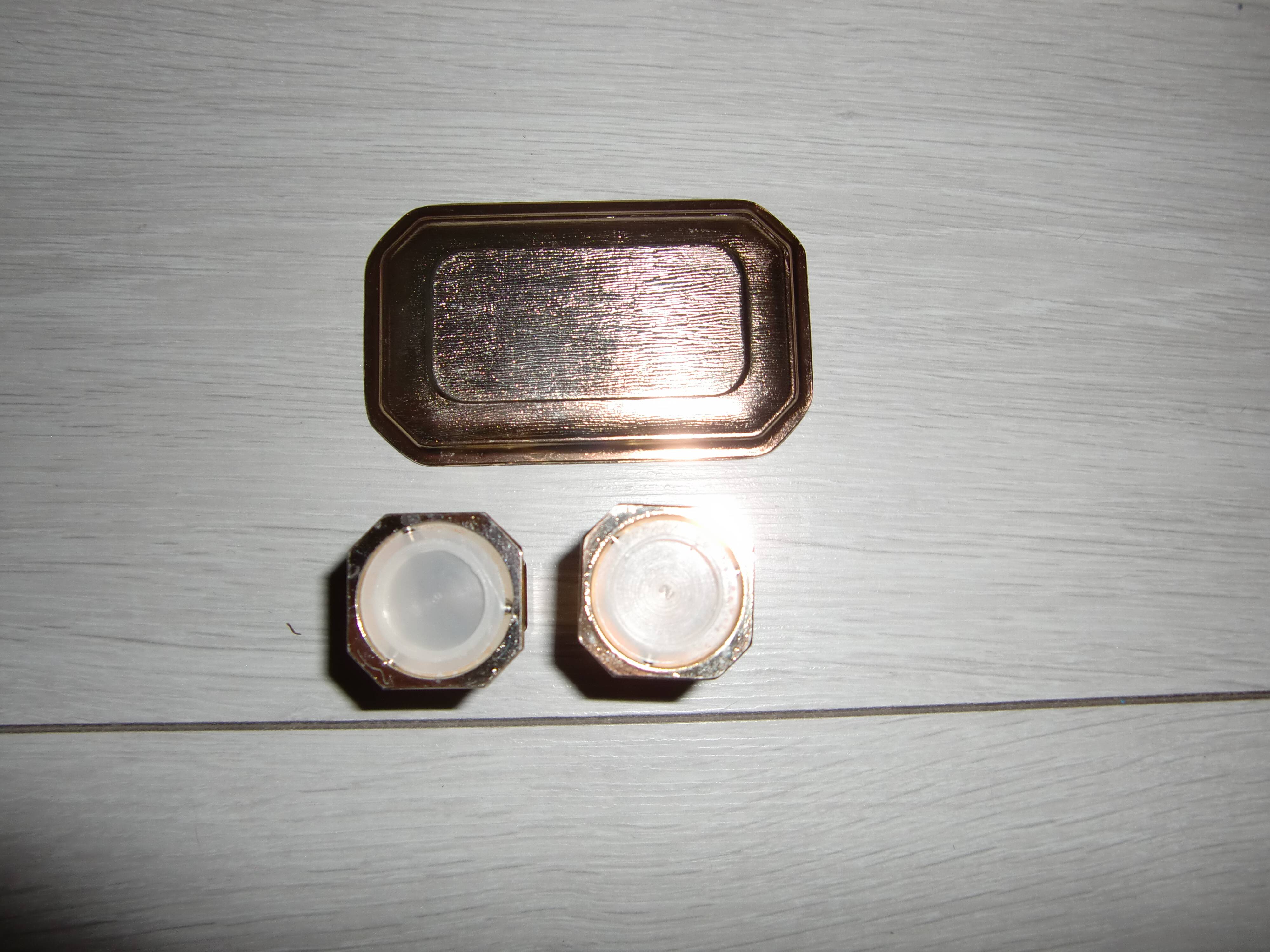 Silver-plated salt and pepper shakers presented on a small tray