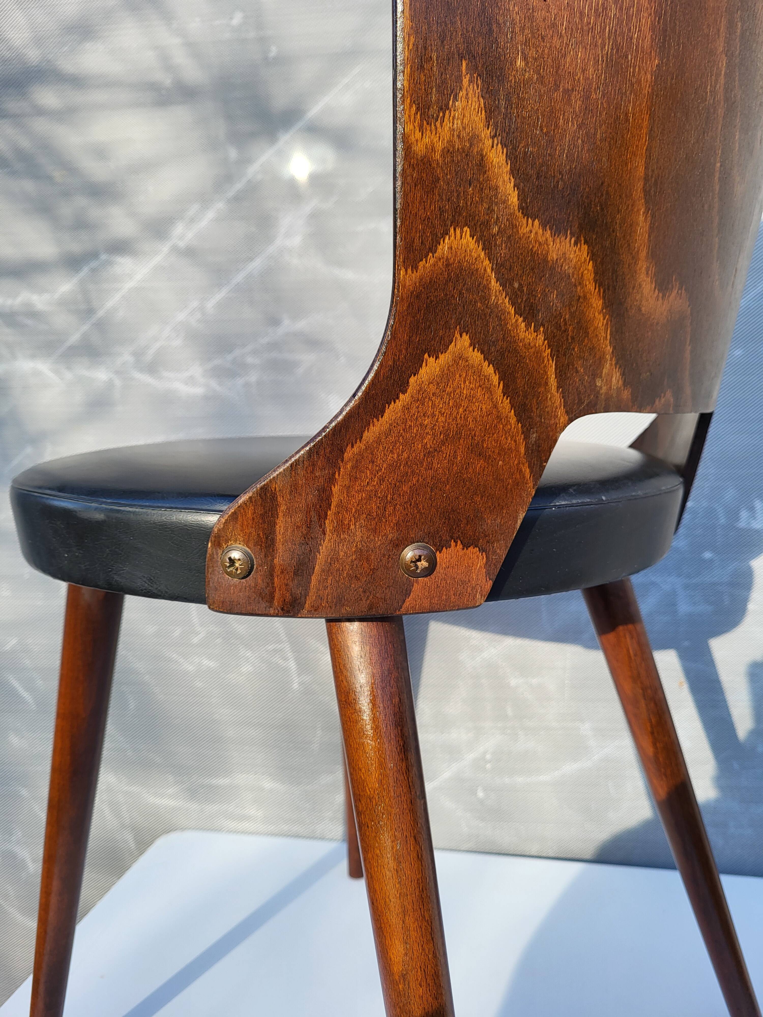 Pair of Dove chairs • Baumann • Black faux leather