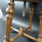 Ancien tabouret de piano tapissé