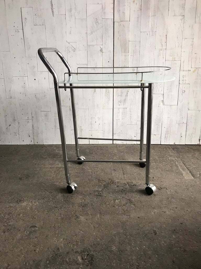Chrome and transparent glass rolling dessert trolley, French Regency style from the 1960s.