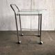 Chrome and transparent glass rolling dessert trolley, French Regency style from the 1960s.