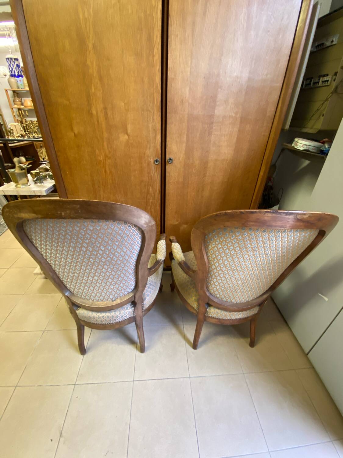 Two Louis XV style wooden and fabric armchairs