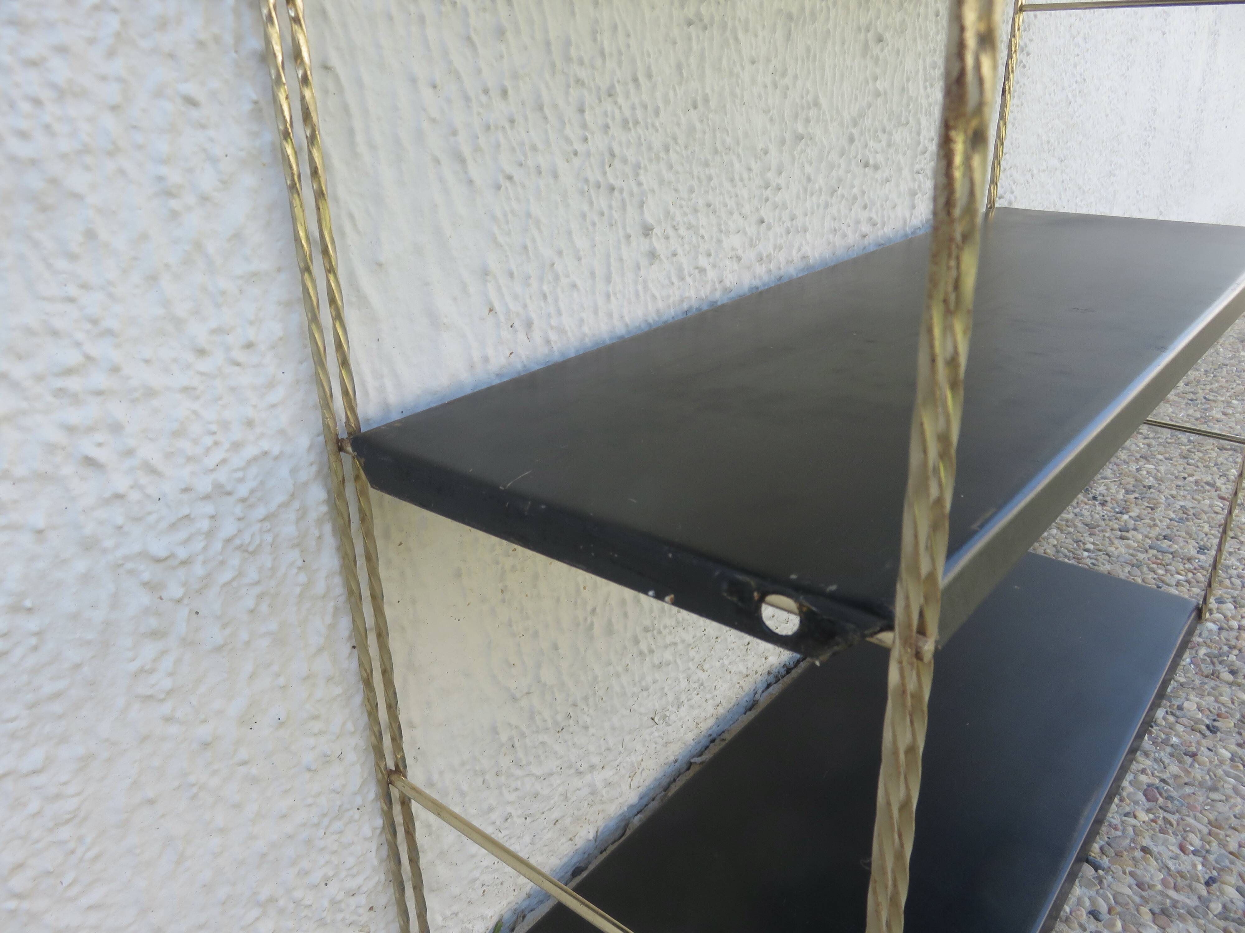 Modular String shelf in gold and black metal