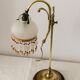 Old lamp adjustable on foot tulip golden brass.