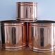 three cylindrical plant pots in a Scandinavian design from the 80s