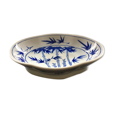Chinese cup decorated with blue bamboo.