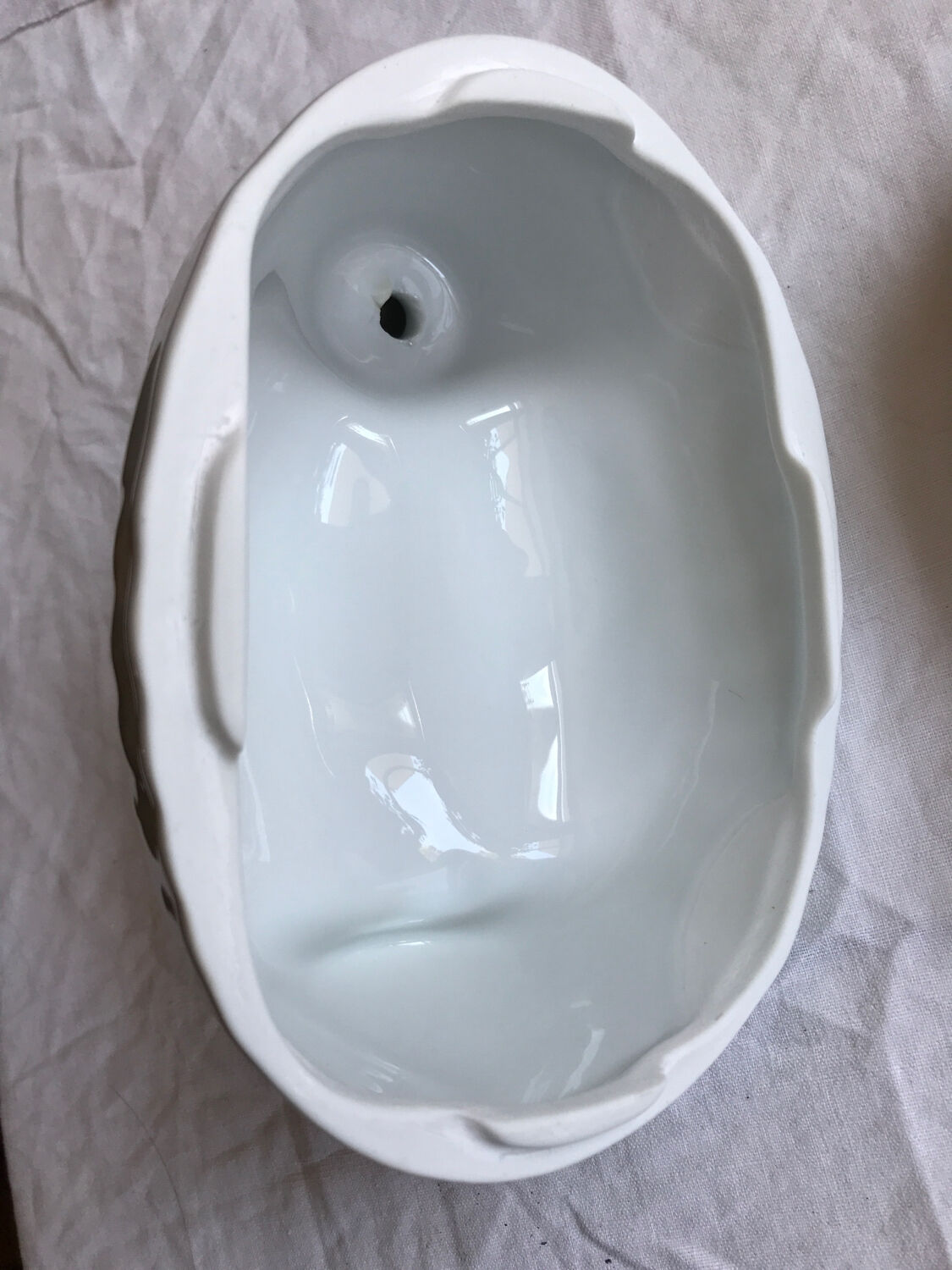 Porcelain duck dish with lid on fire