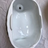Porcelain duck dish with lid on fire