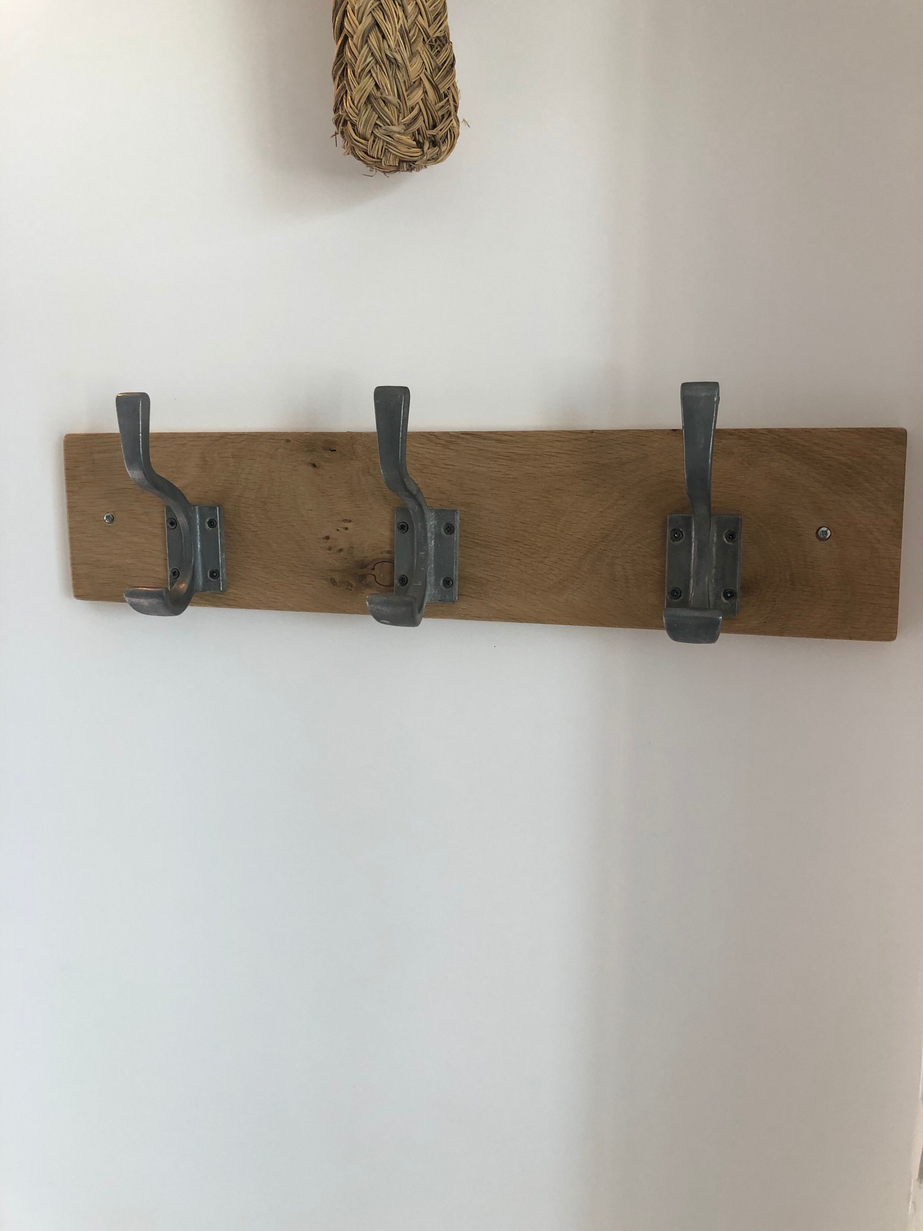 Three-hooked patères on blond oak from a local school in the 50s/60s