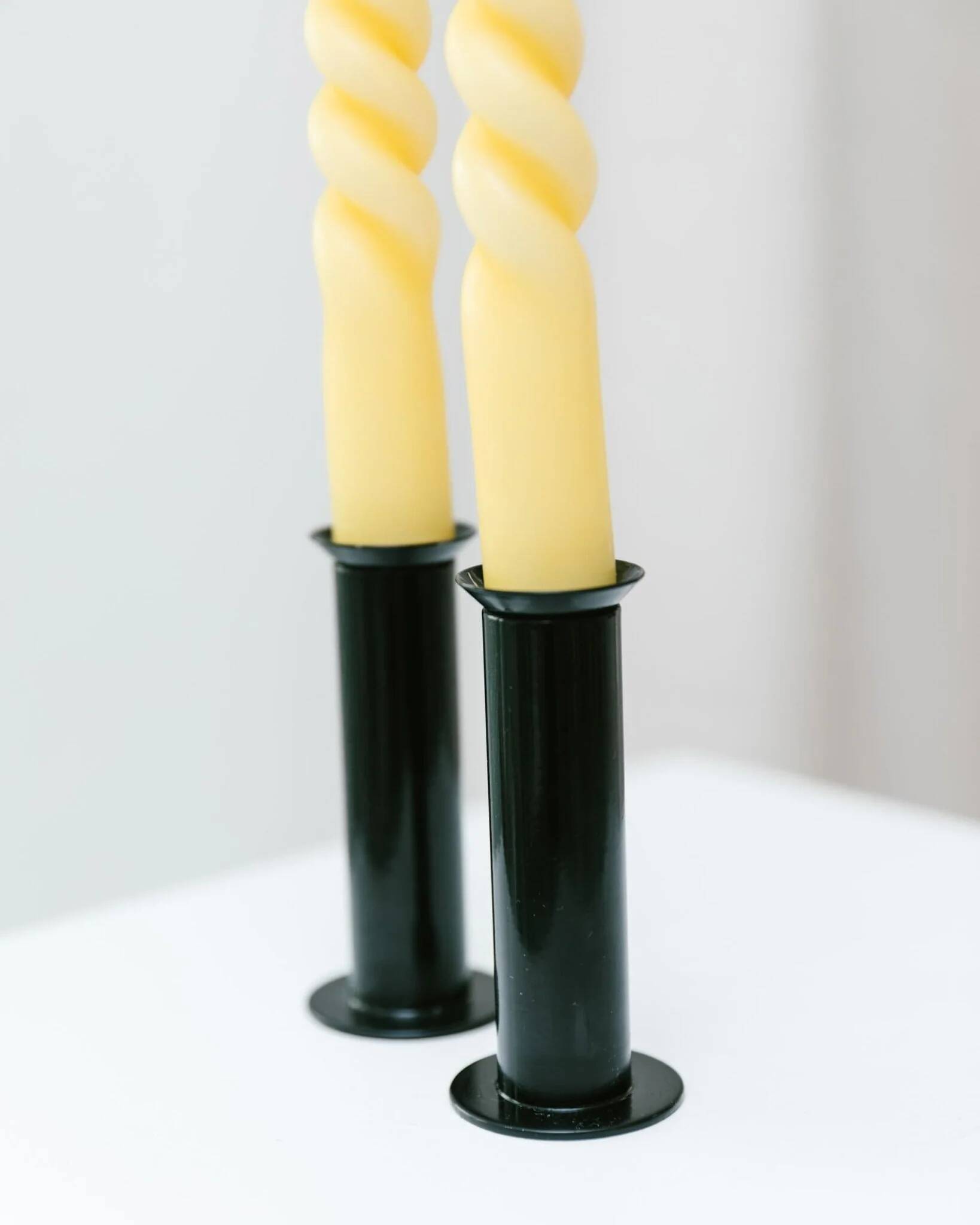 Set of 2 glossy black metal candleholders in retro Ikea Memphis style