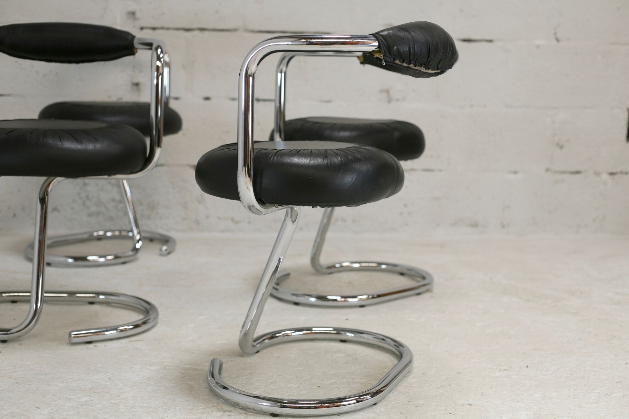 4 chairs tubular steel, imitation black leather, Italy, circa 1970