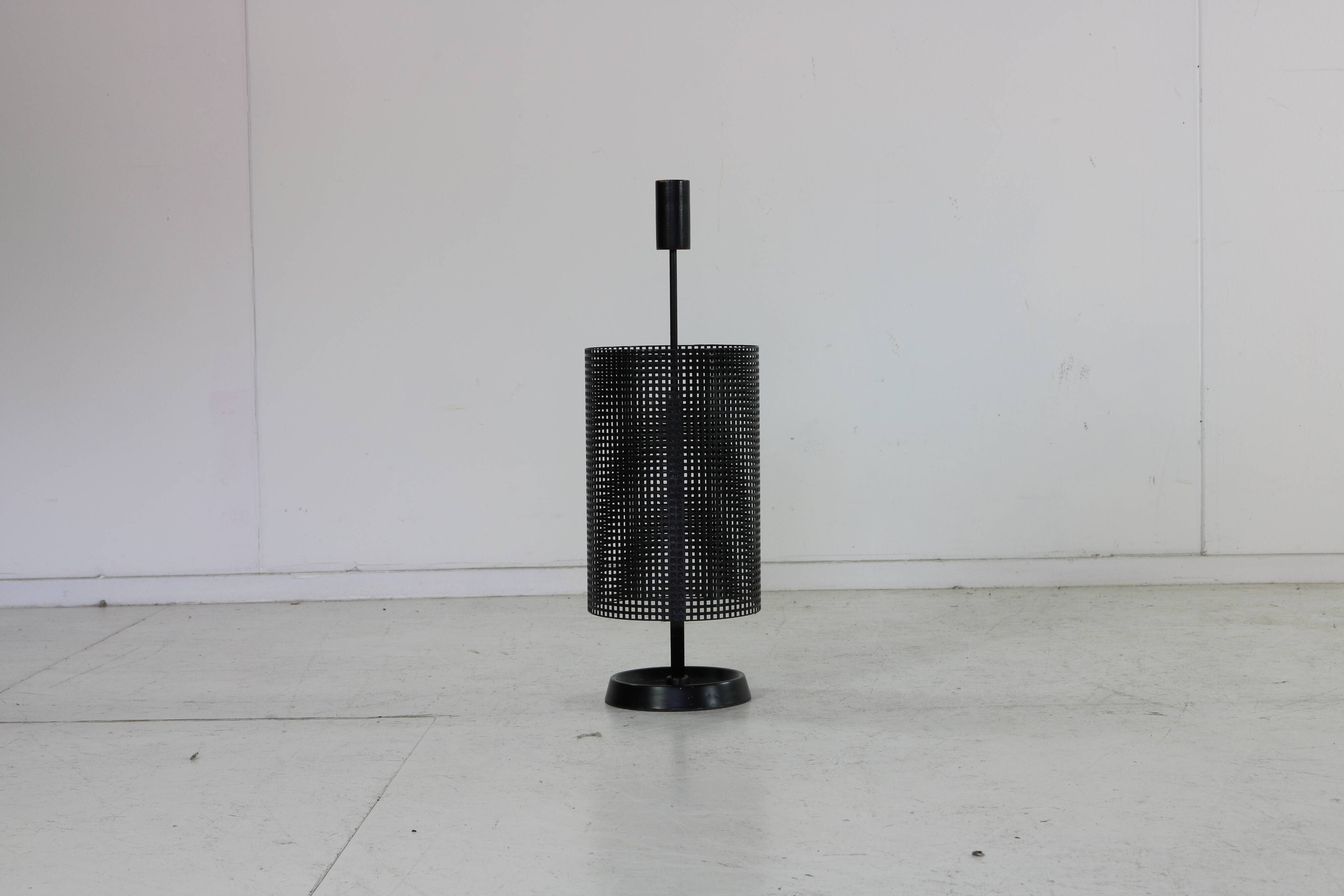 Minimalistic dutch design perforated metal umbrella stand