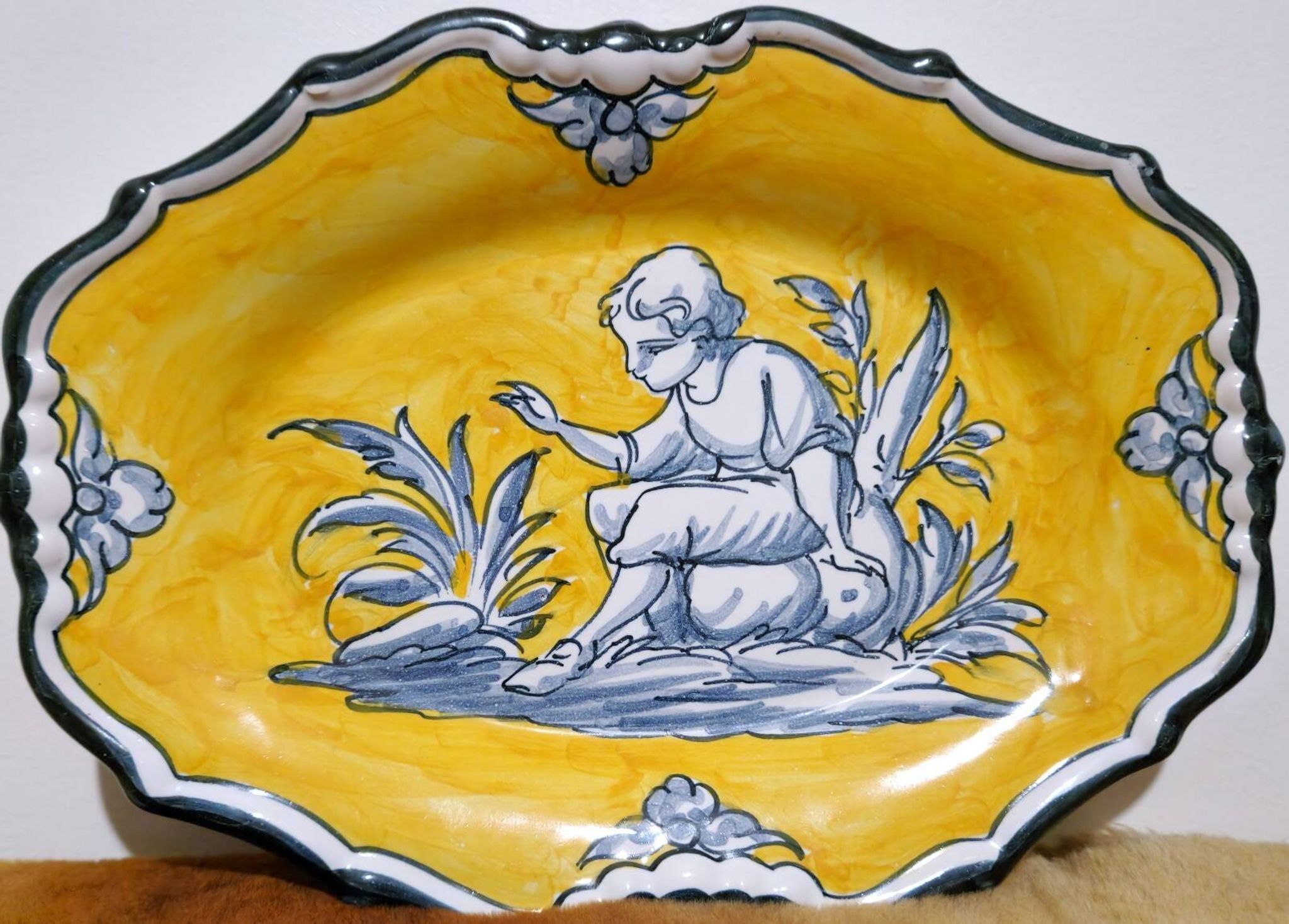 Pair of oval dishes in hand-painted faience with an Italian majolica spirit.
