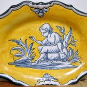 Pair of oval dishes in hand-painted faience with an Italian majolica spirit.