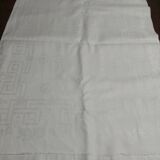 Table napkins set of eleven in a single piece damask linen and silk early 20th century.