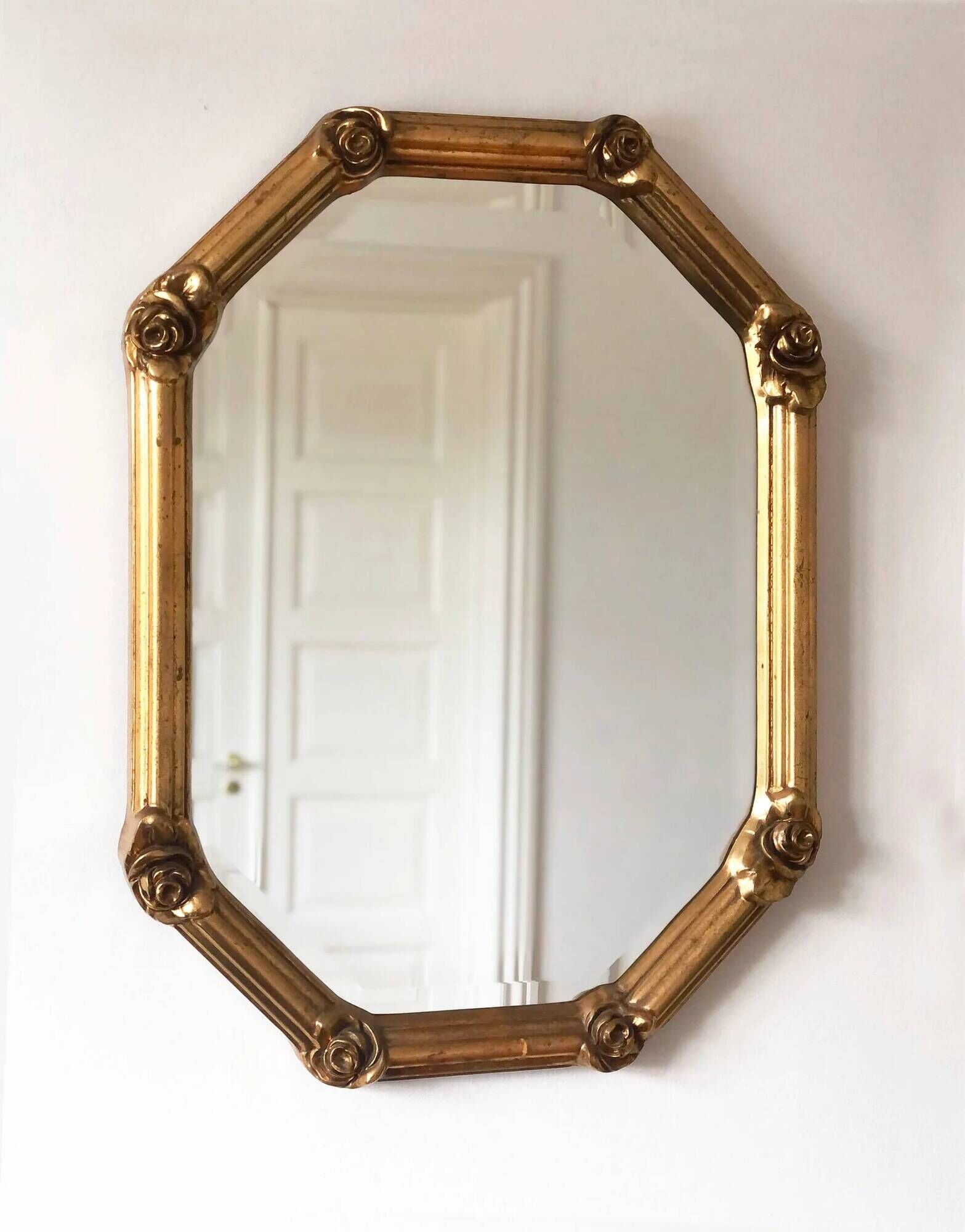 Vintage octagonal giltwood bevelled mirror with rose accents