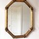 Vintage octagonal giltwood bevelled mirror with rose accents