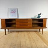 Vintage teak sideboard with rounded edges and sliding doors – mid-century Scandinavian design.