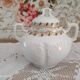 White porcelain sugar bowl decoration in relief and green and gold frieze