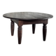 Antique round coffee table in Indonesian teak with turned legs.