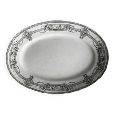 Plat ovale ancien en faïence, décor néoclassique noir et blanc