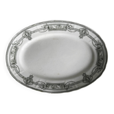 Plat ovale ancien en faïence, décor néoclassique noir et blanc