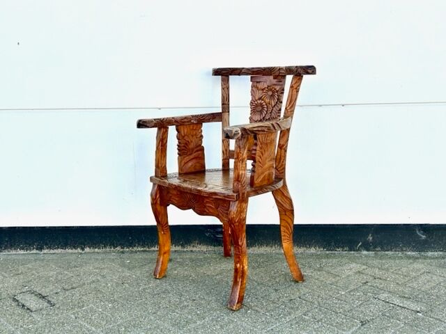 Hand stabbed teak armchair
