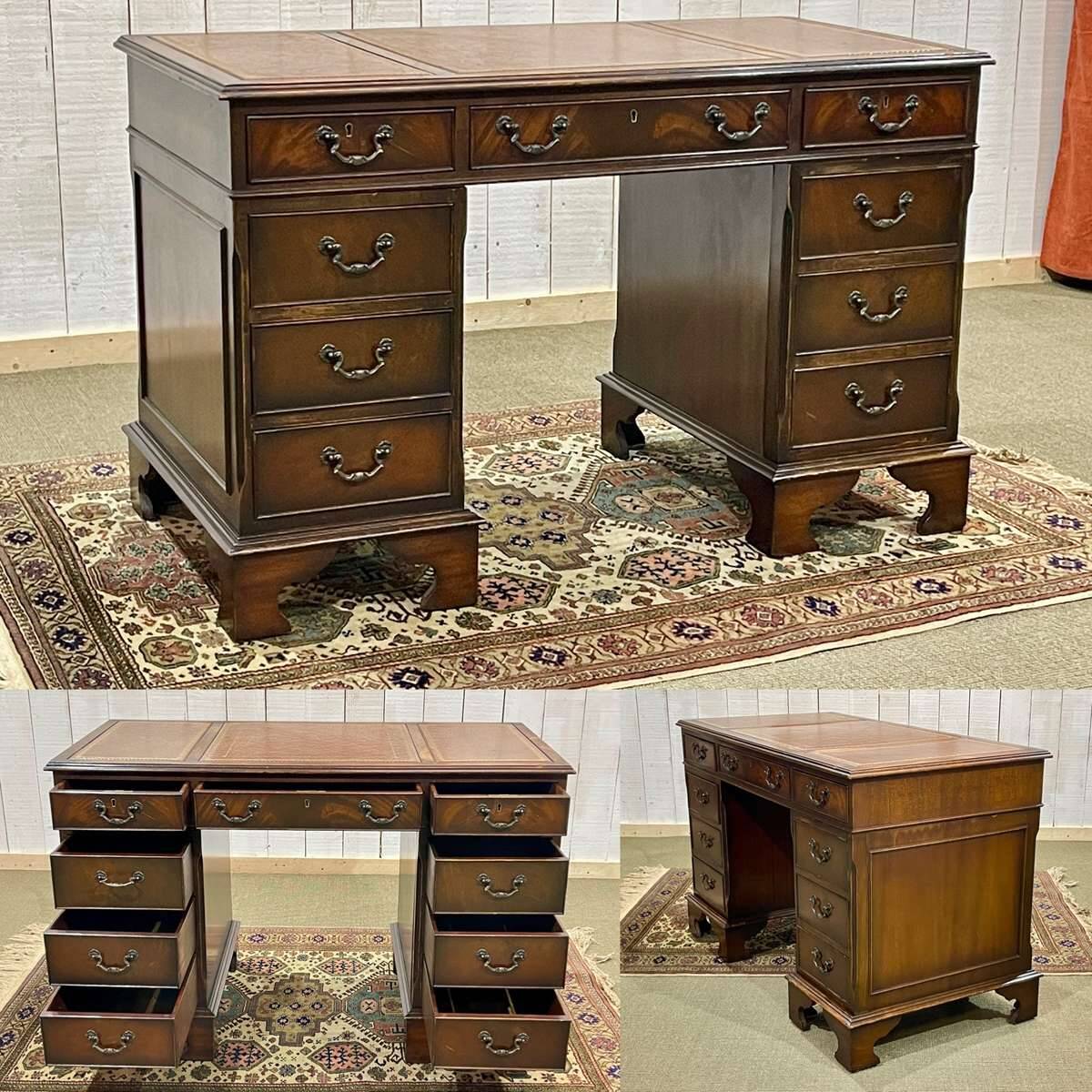 English mahogany pedestal desk with leather top from the 1950s