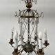 Louis XVI style chandelier with a pearl garland and painted tin, 20th century.