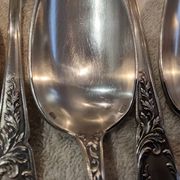 12 silver-plated metal dessert spoons, silversmith SFAM, rocaille design, 19.1 cm.