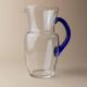 Vintage glass pitcher - clear glass with blue handle - Mid-Century design from Italy in the 1970s - elegant table decoration, retro gift idea.
