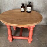 Round coffee table made of solid wood in orange color (soft color)