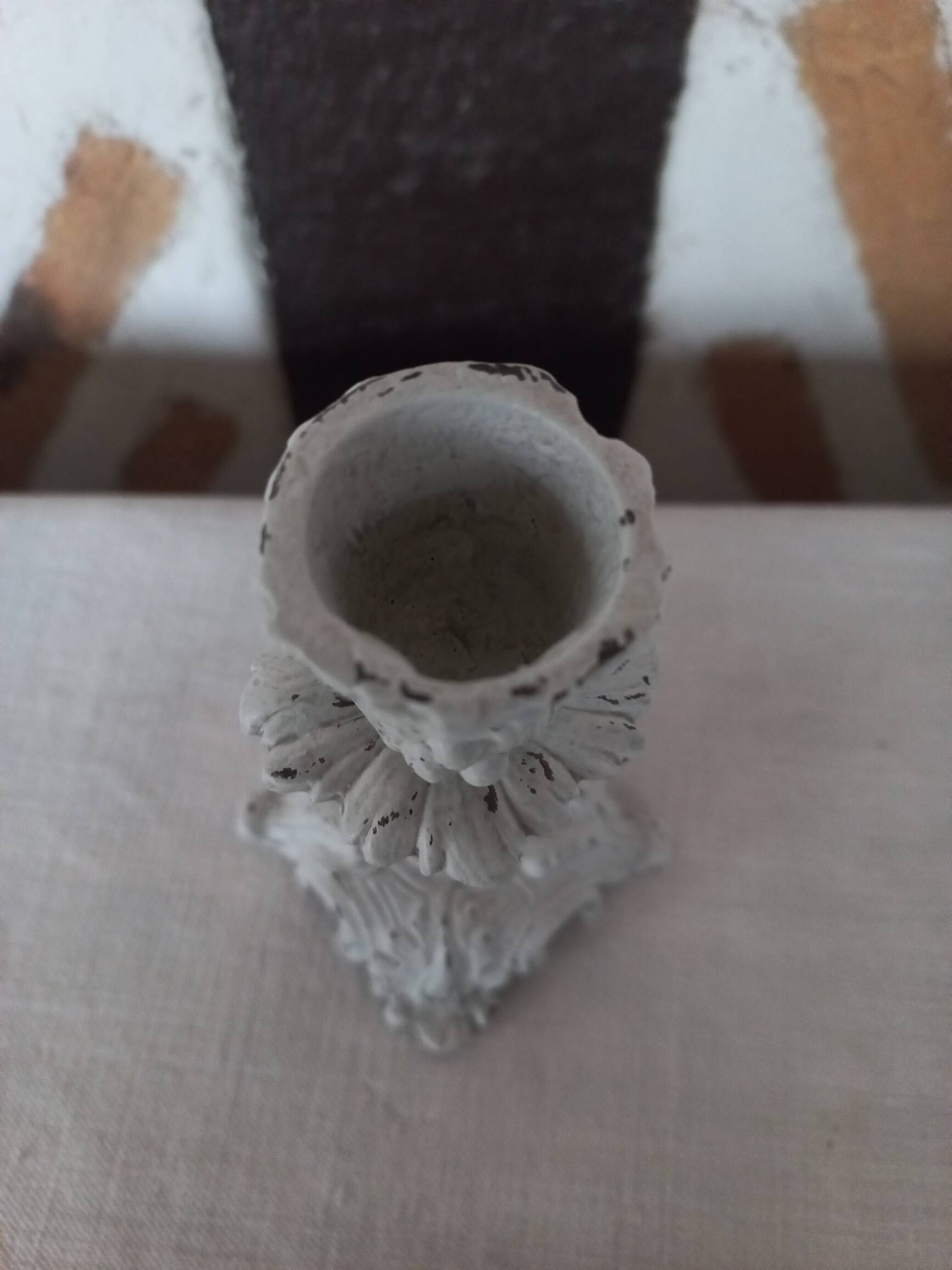 Old grayed white patinated candle holder