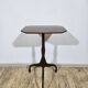 Antique octagonal mahogany side table on a classic tripod, 19th century.