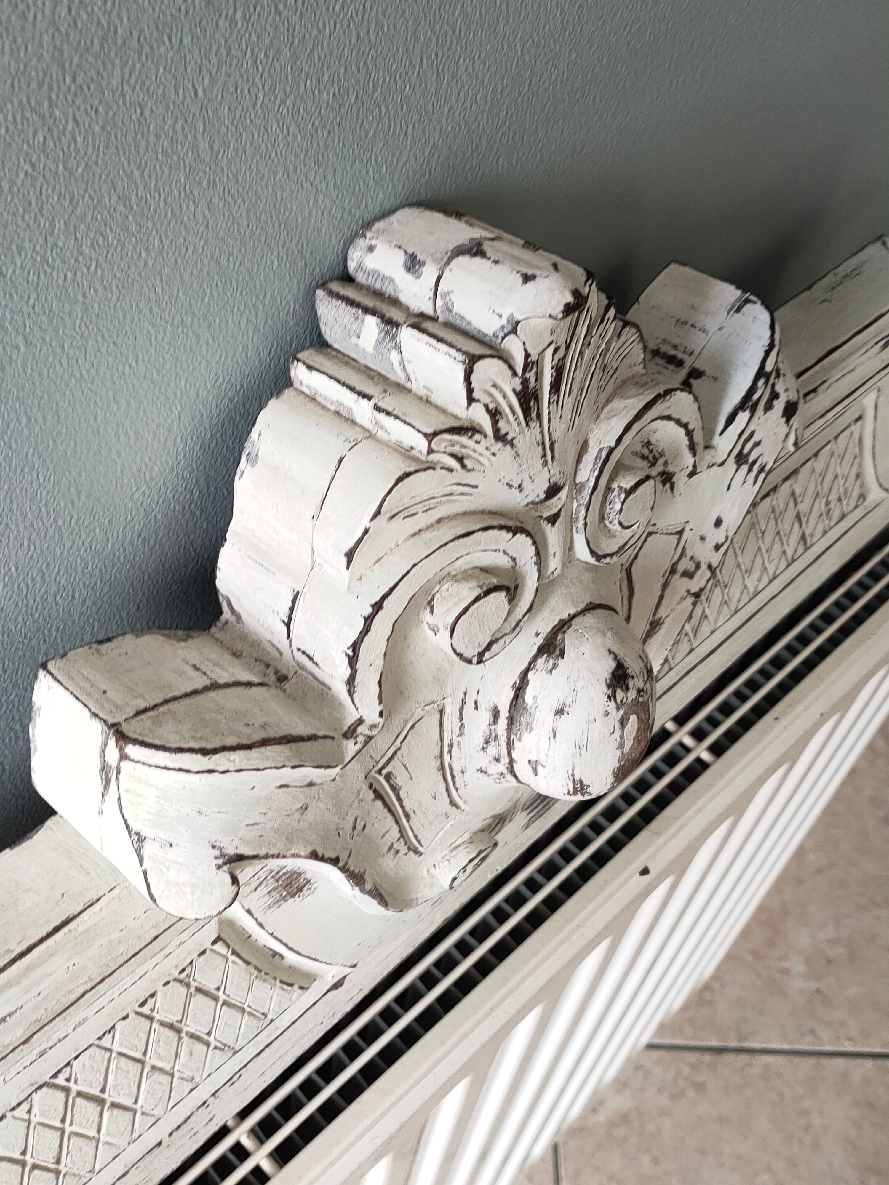 Old pediment in painted wood