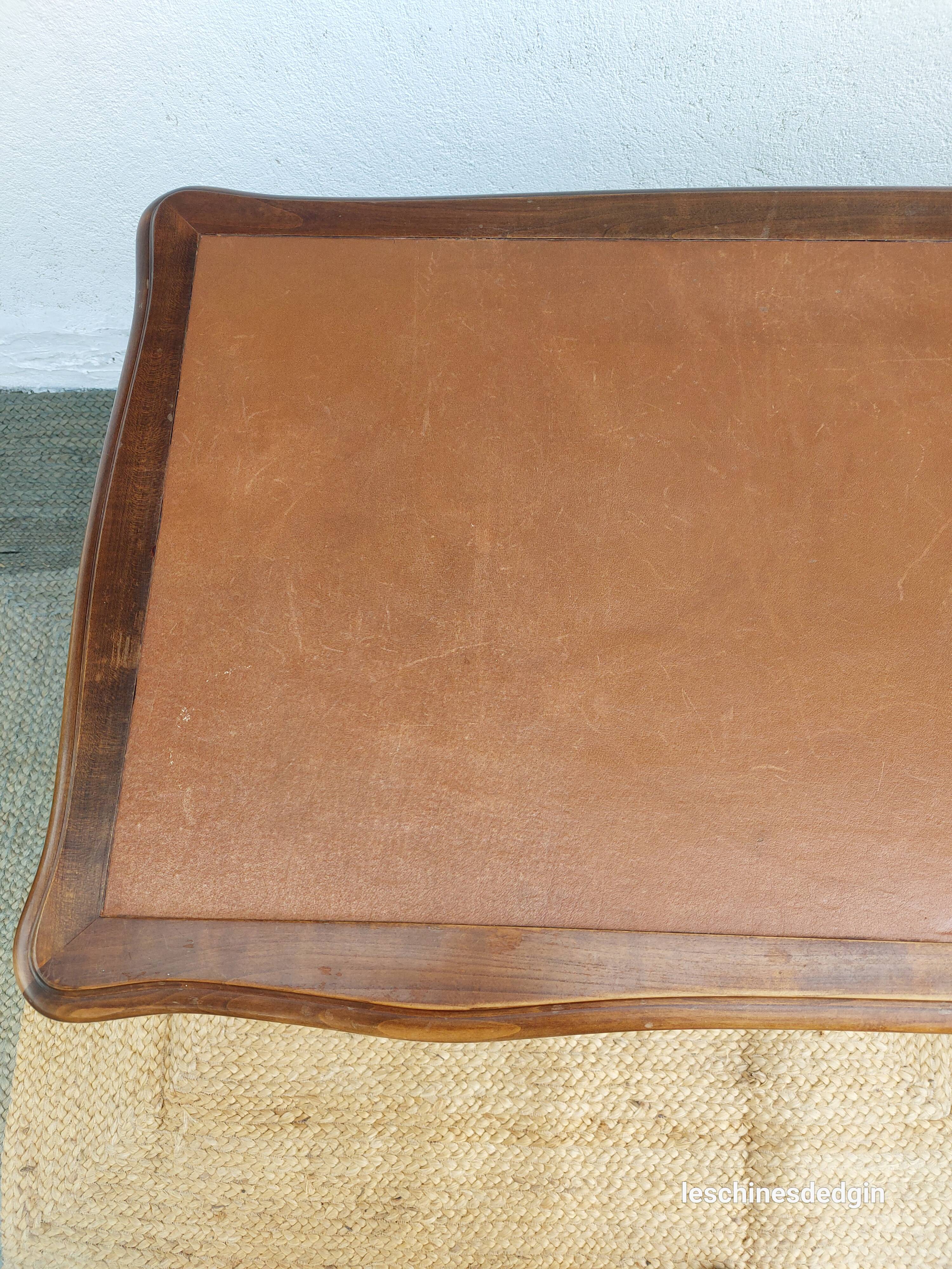 Louis XV style desk in wood, with a brown leather top.