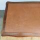 Louis XV style desk in wood, with a brown leather top.