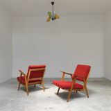 Pair of armchairs in mottled red and wood by Uluv, former Czechoslovakia 1960