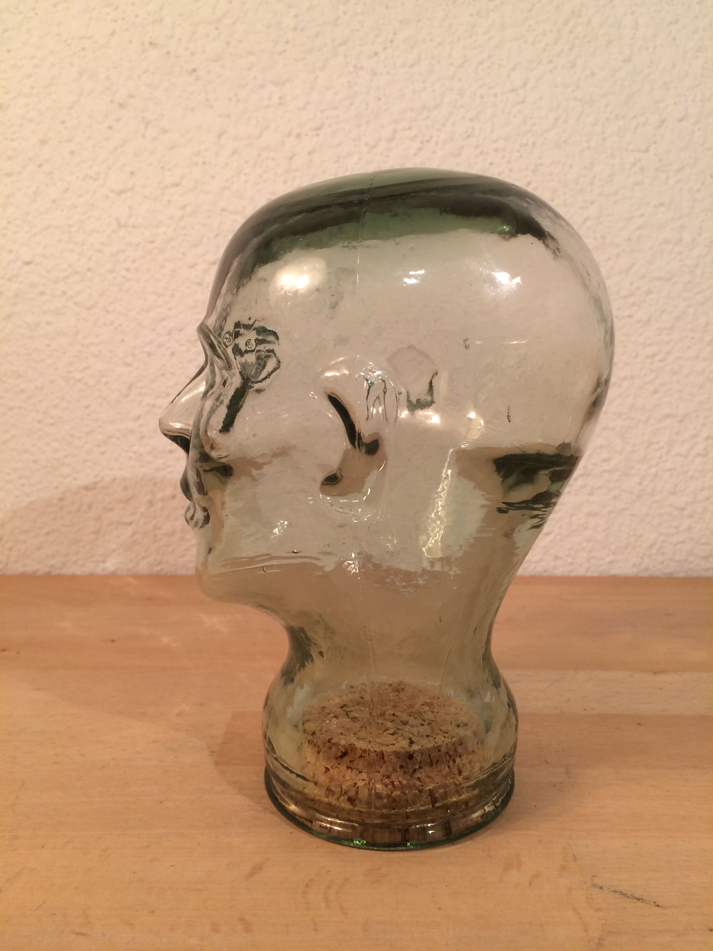 Molded glass head curiosity cabinet