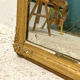 Miroir ancien en bois et stuc doré