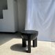 Black mango wood tripod side table with a semi-spherical top, height: 45 cm, diameter: 44 cm.