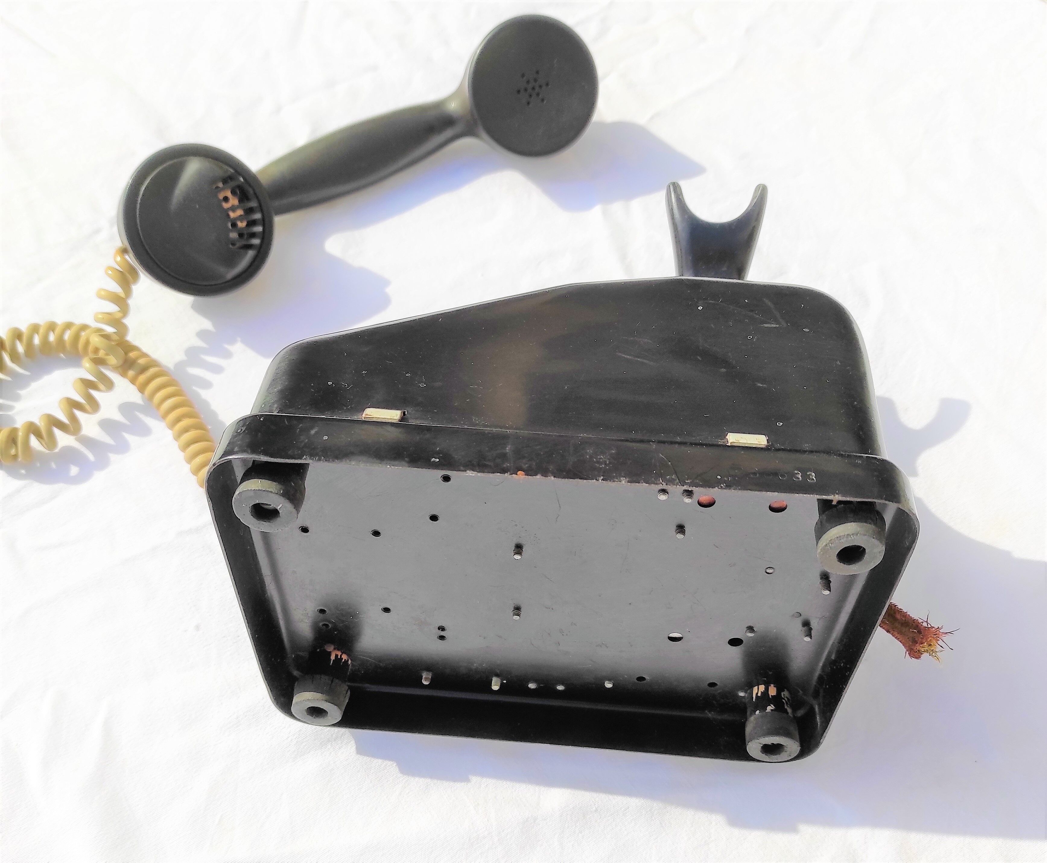 Telephone in black bakelite dial with call system