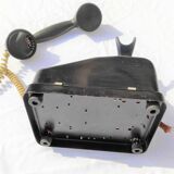 Telephone in black bakelite dial with call system