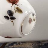 Golden tilting wall light with flowered globe