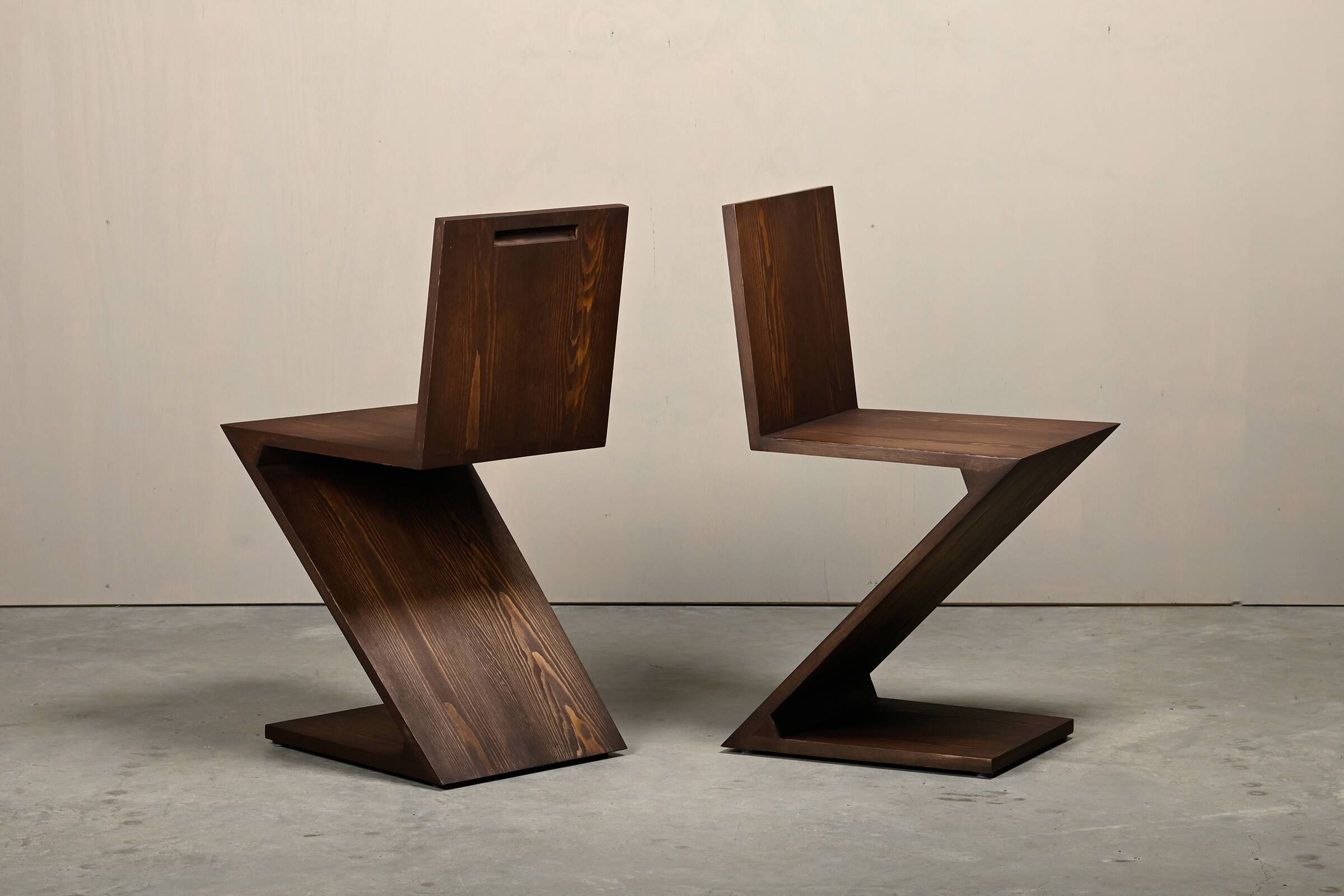 Gerrit Rietveld Zig Zag Chair is dark brown stained wood